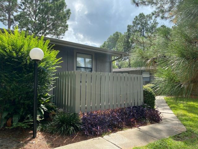 a white fence in front of a house