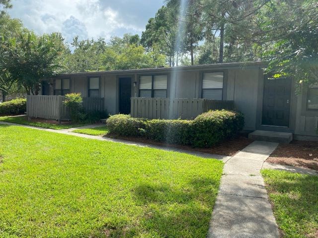a house with a sidewalk in front of it