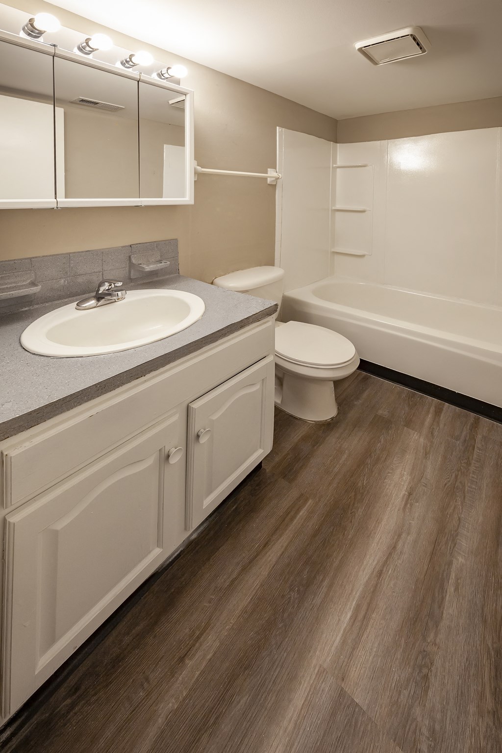 a bathroom with a sink toilet and a bath tub