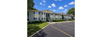 A sunny day at the apartment complex with a clear blue sky.