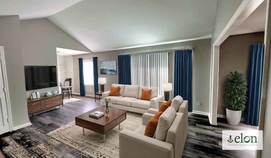 A living room with a white couch and a coffee table.