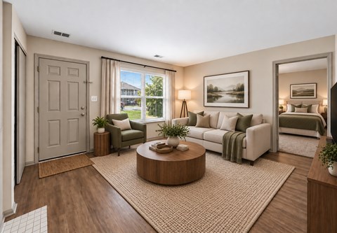 A well-lit, modern living room with a large window, a sofa, a coffee table, and a bed in the background.