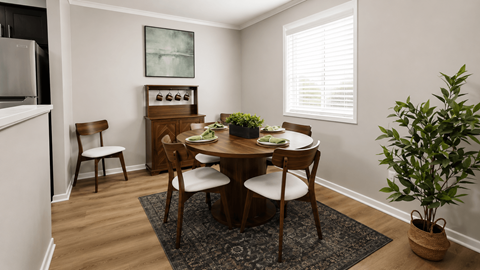 A dining room with a table set for four.