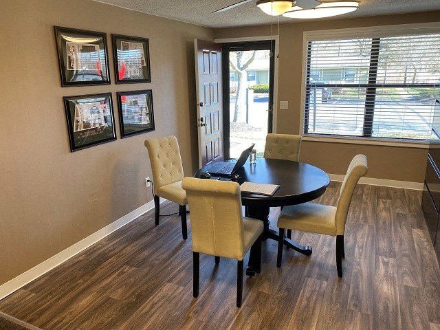 a dining room with a table and chairs