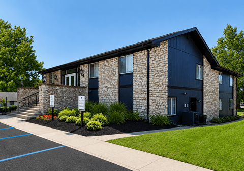 A building with a stone facade and dark blue trim.