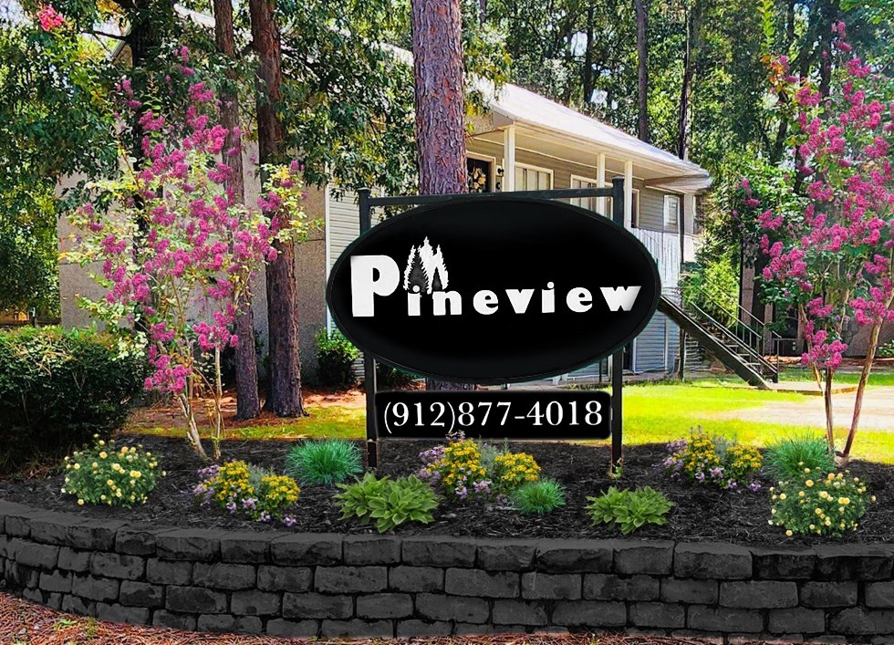 a sign in front of a house