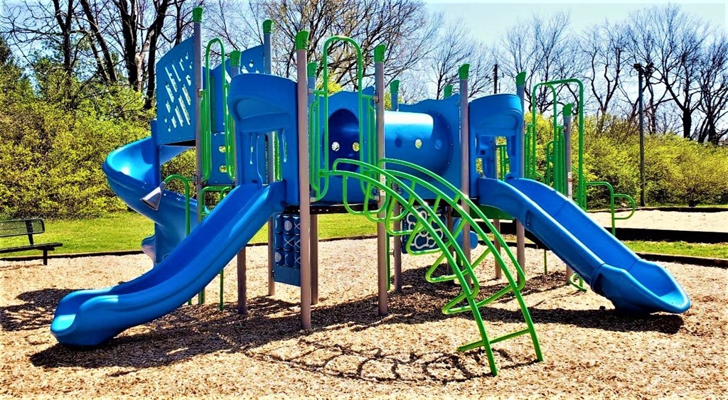a group of children playing on a playground