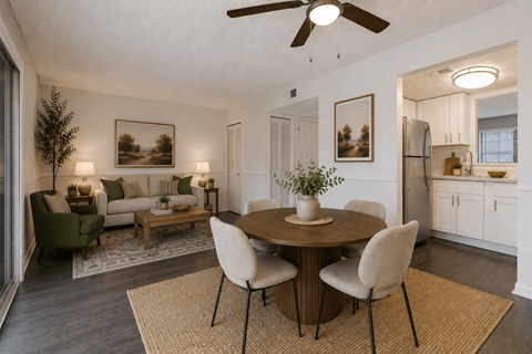 A dining room with a table set for four.