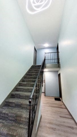 a set of stairs with a railing and