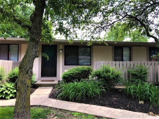 a house with a tree in front of it