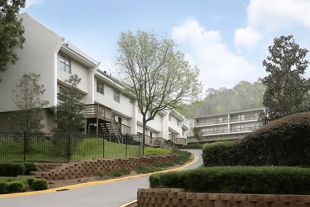 A residential area with houses and a curved road.