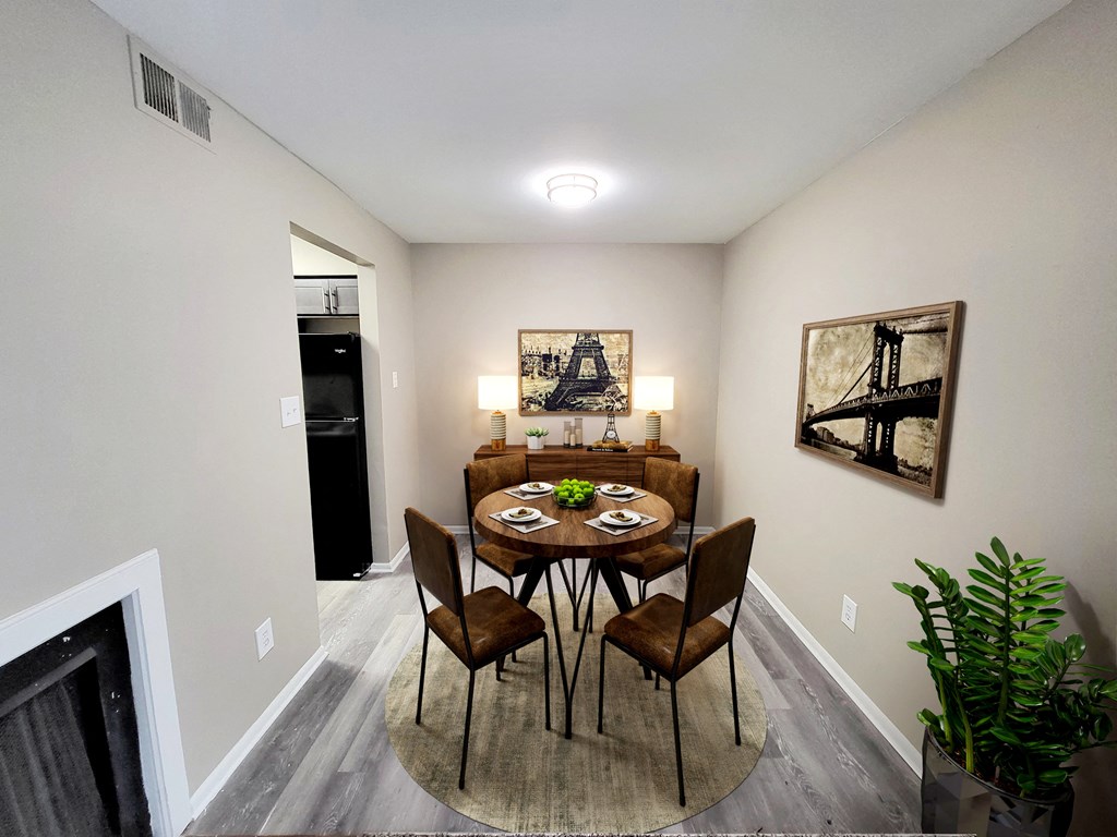 a dining room with a table and chairs and a fireplace