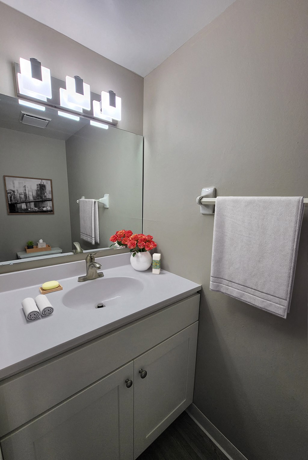 a small bathroom with a sink and a mirror