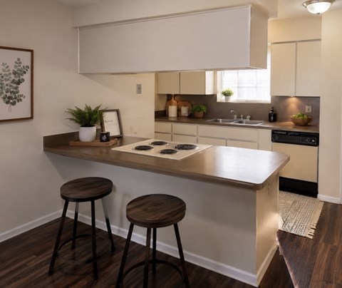 A kitchen with a white countertop and brown stools.