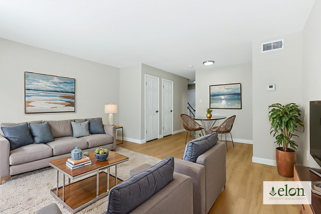 A living room with a grey couch and a coffee table.