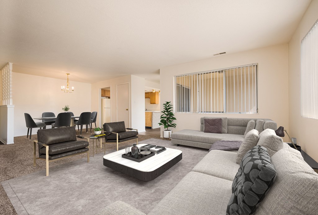 a living room with couches chairs and a coffee table