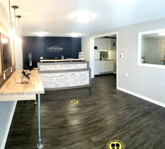 a lobby with a counter and a reception desk