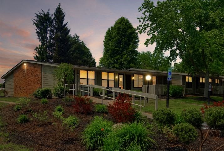 a house with lights on in the evening
