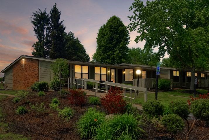 a house with lights on in the evening