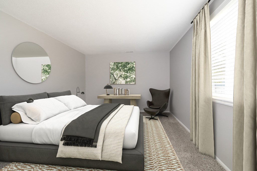 a bedroom with a bed and a chair and a round mirror