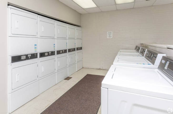 the laundry room is equipped with washers and dryers