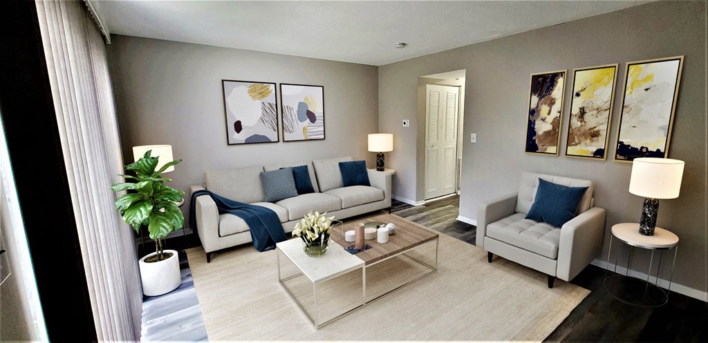 a living room with couches and a coffee table