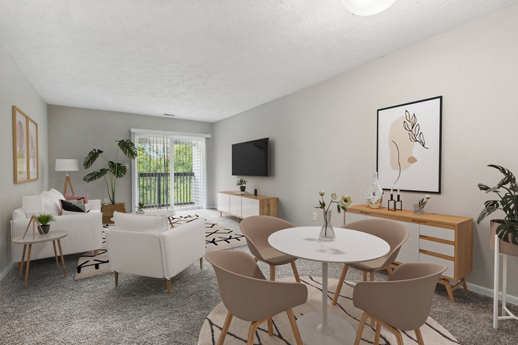 A living room with a white table and chairs.