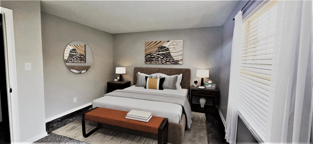 a bedroom with a large bed and a window