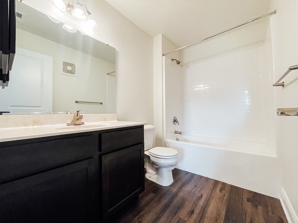 an empty bathroom with a toilet and a sink