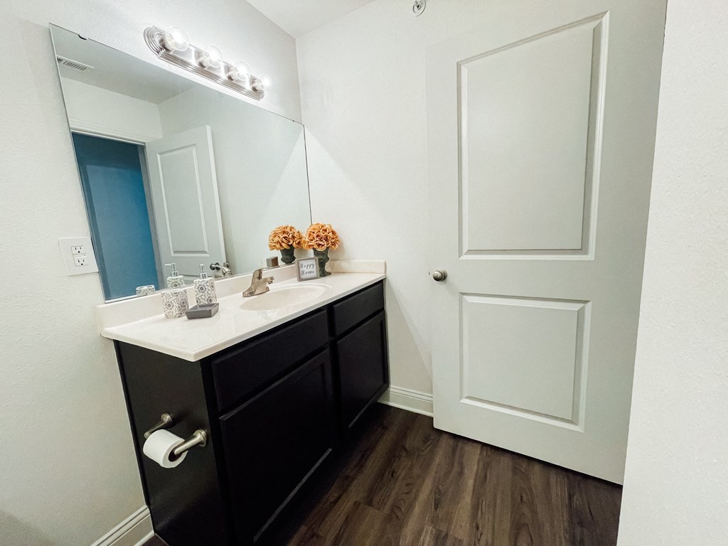 an empty bathroom with a sink and a mirror