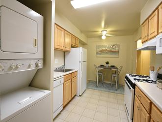 Stacked washer and dryer and eat in space at Deer Park Apartments