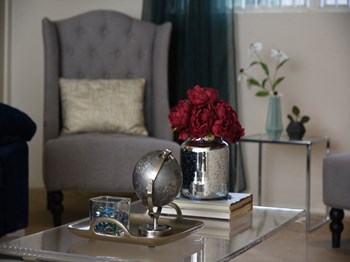 Carpeted living room at Deer Park Apartments - Photo Gallery 4
