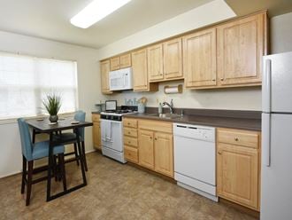 Bright eat in kitchen with extra storage at Kingston Townhomes, Baltimore, MD