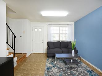 Large living room with lots of natural light  at Kingston Townhomes, Baltimore, MD