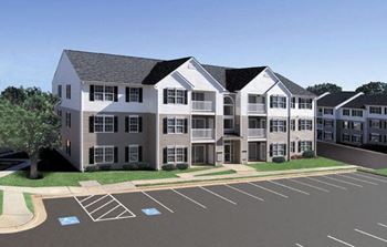 Large apartment building sitting on top of a parking lot at The Summit at Owings Mills Apartments, Maryland, 21117