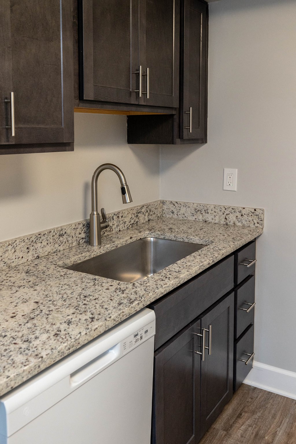Kitchen with a sink and a dishwasher at McDonogh Village Apartments & Townhomes, Randallstown, MD, 21133