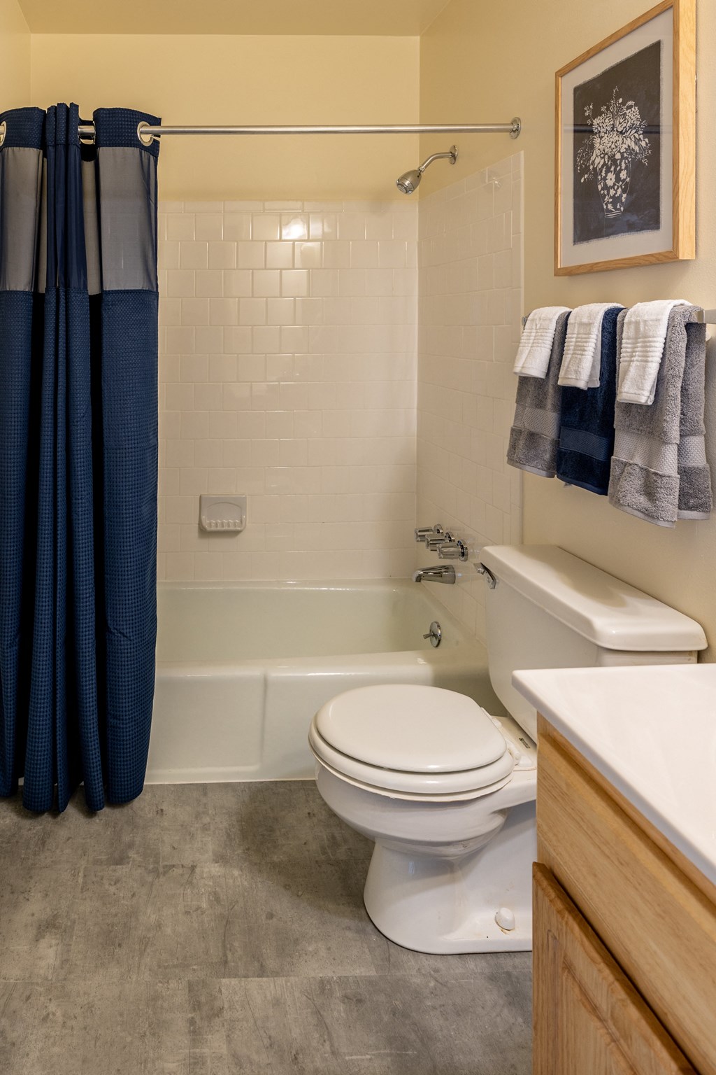 Bathroom with a white toilet next to a white bathtub at Seven Oaks Townhomes, Edgewood, MD