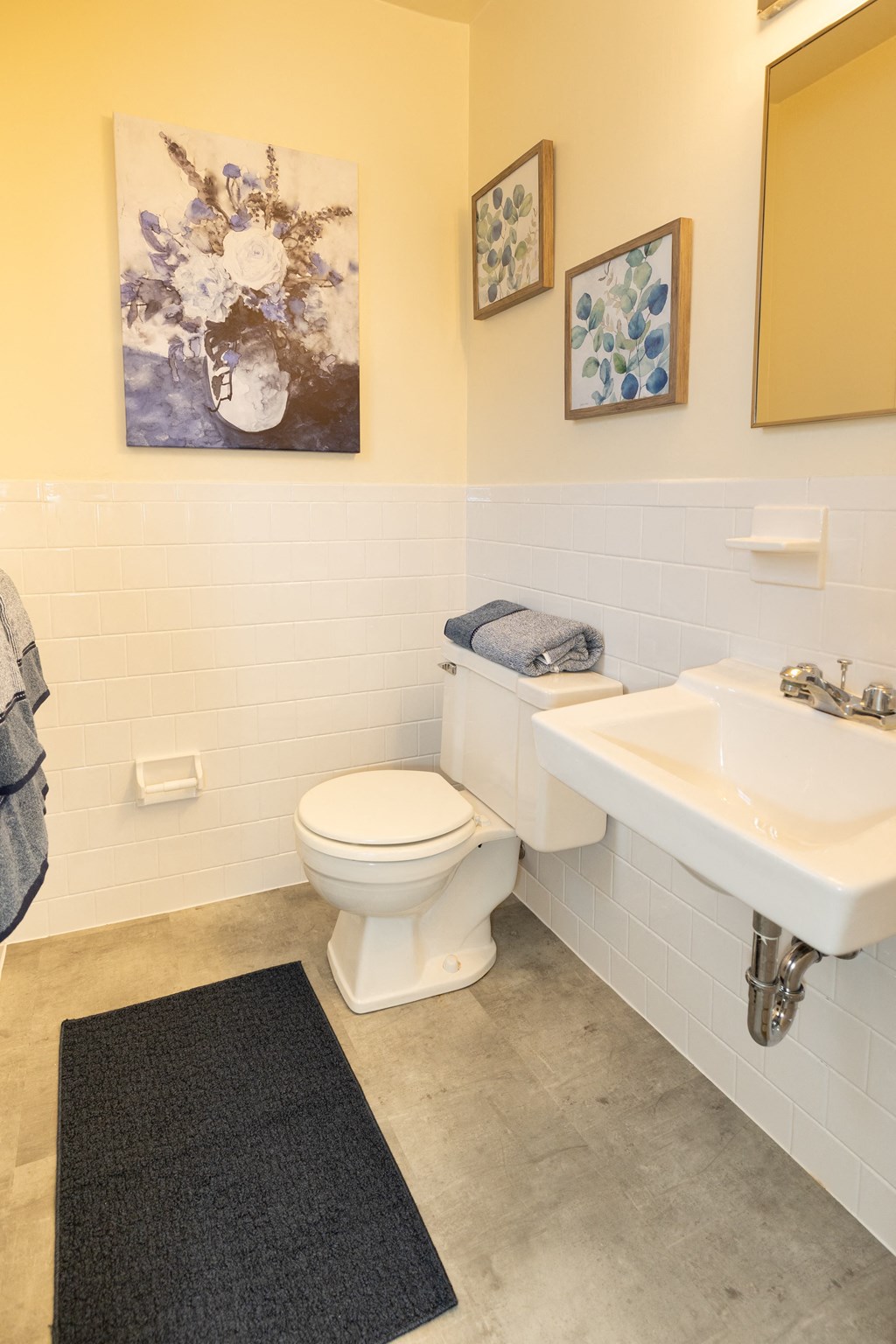 White bathroom with a sink and a toilet at Rockdale Gardens Apartments*, Baltimore, MD