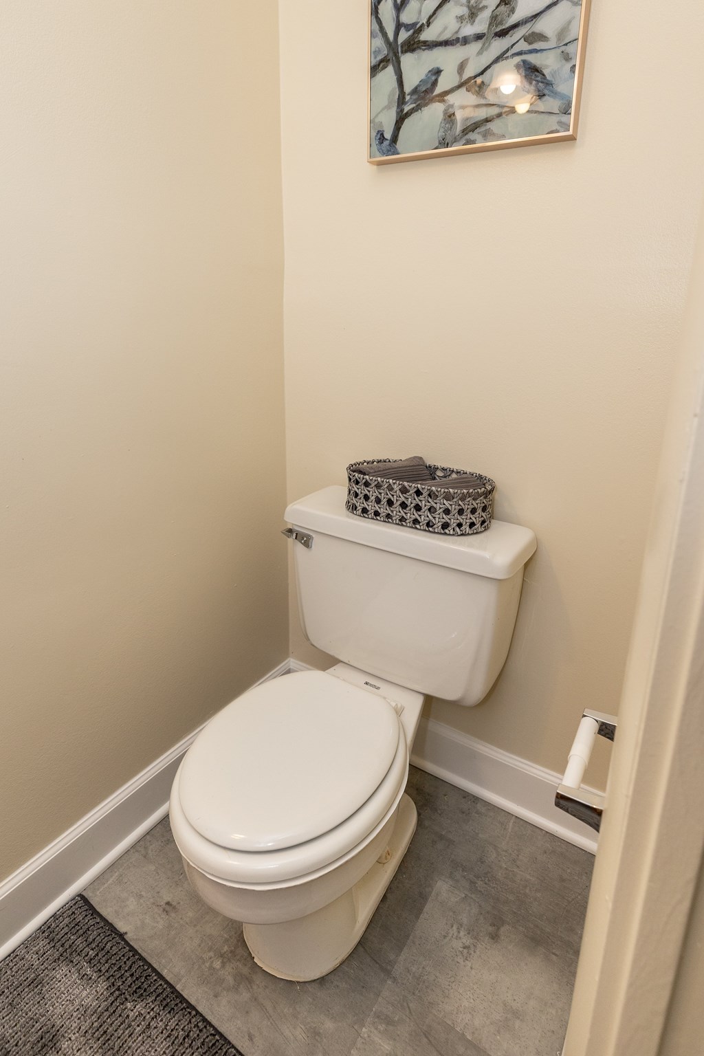 Small bathroom with a toilet and a painting on the wall at Seven Oaks Townhomes, Edgewood, Maryland, 21040
