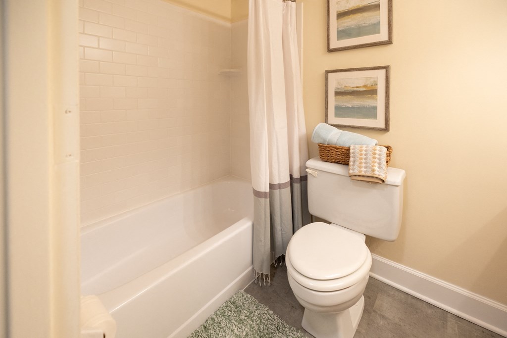 Bathroom with a toilet and a tub at Ivy Hall Apartments*, Towson, MD 21204