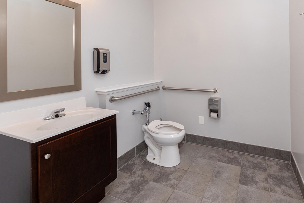 Accessible bathroom with a toilet and a sink at Cromwell Valley Apartments, Towson, MD