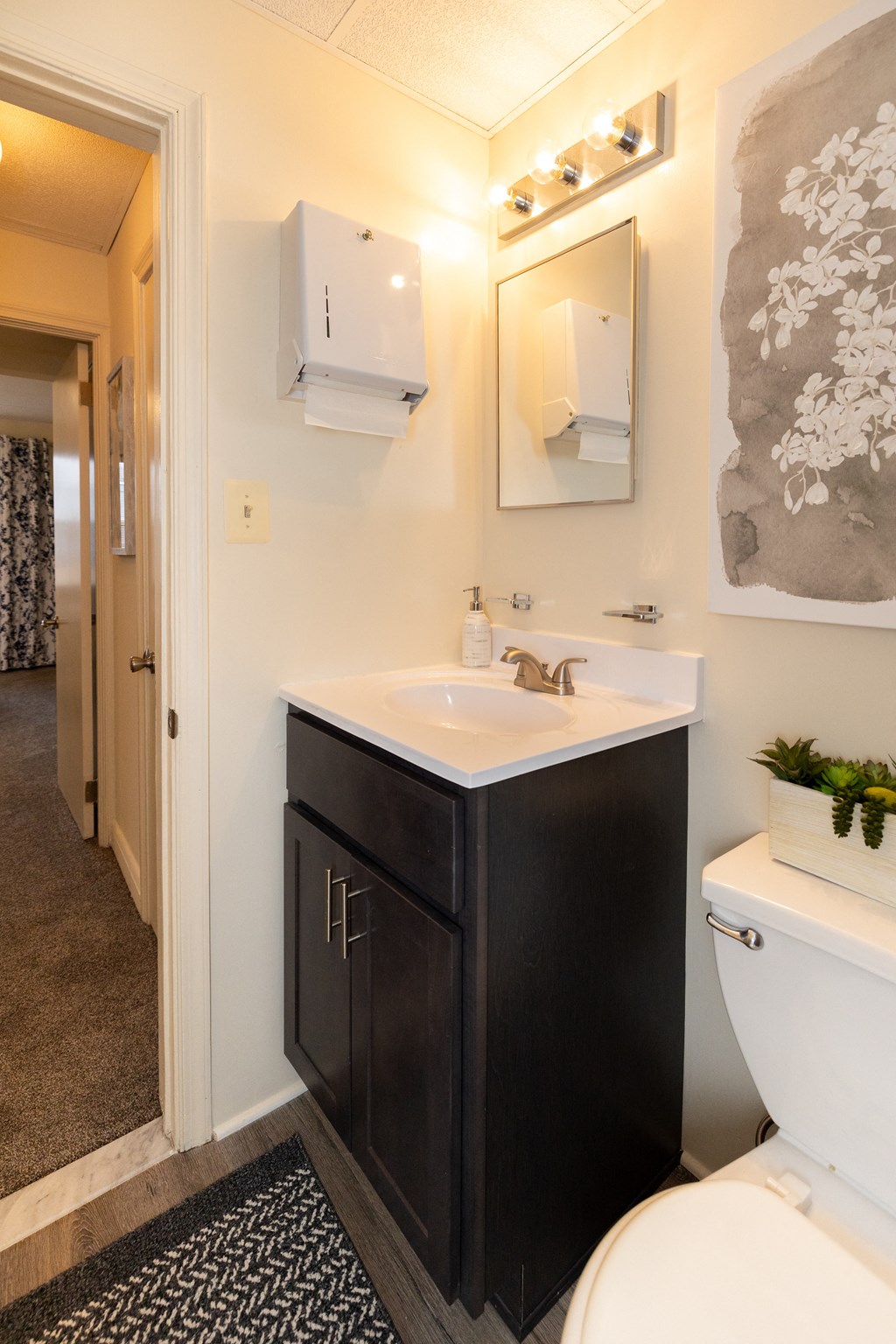 Bathroom with a sink and toilet at Loch Bend Apartments, Baltimore, MD.