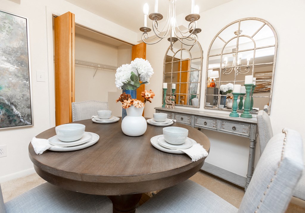 Spacious and bright dining room with storage at Spring Hill Apartments & Townhomes, Baltimore, MD