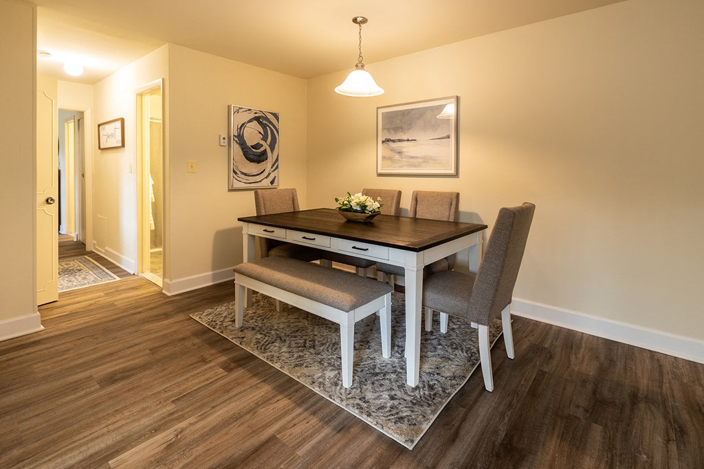 Dining room with six person table with chairs and bench in Randallstown, MD 21133.