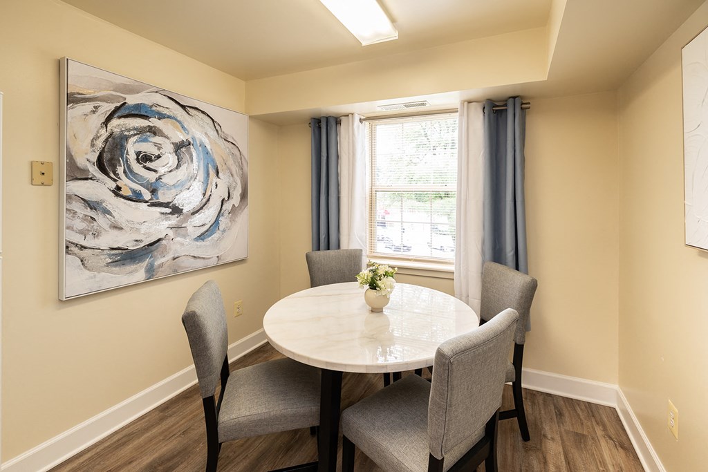 Eat-in dining area with a table and chairs with window in Randallstown, MD