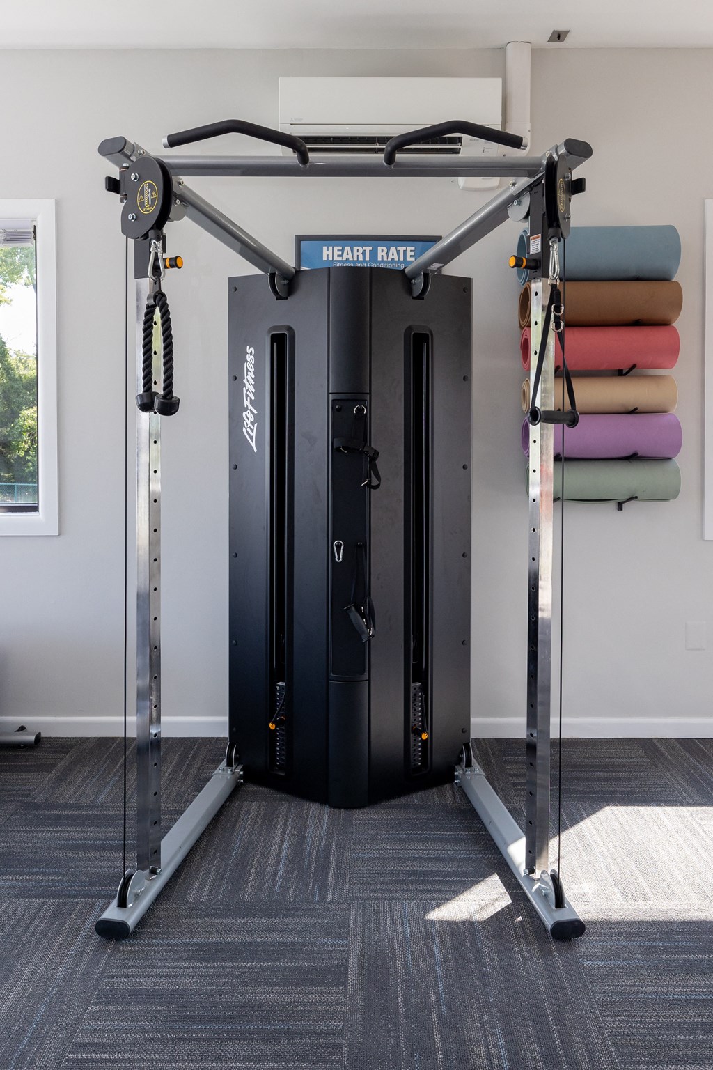 Gym with a pair of cardio machines at Cromwell Valley Apartments, Towson