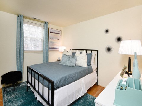 Bedroom with a bed and a window at Hyde Park Apartments*, Essex, MD