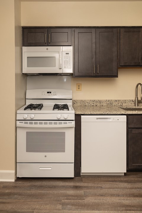 A kitchen with a white oven and a white dishwasher at Lawyers Hill Apartments, Elkridge, 21075