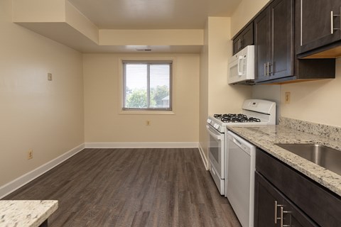 A kitchen with a stove, oven, and cabinets at Lawyers Hill Apartments, Elkridge, 21075