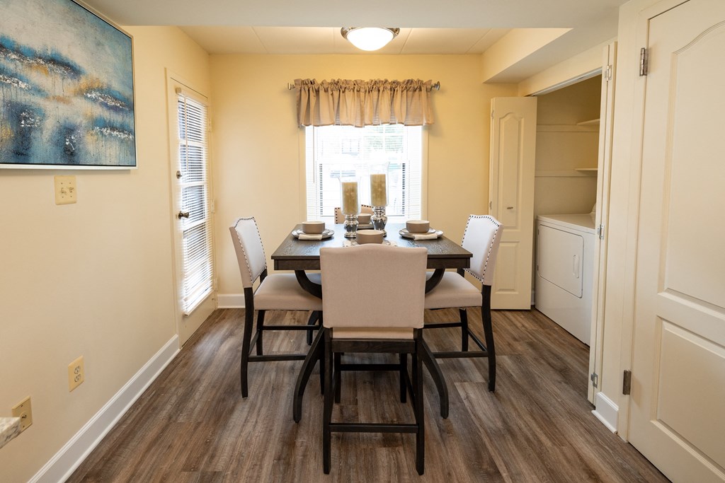 View of a dining room with a table and chairs at Ivy Hall Apartments*, Towson, MD